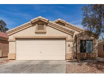 Charming single-story home featuring a two-car garage, neutral stucco, and tile roof at 23430 W Pima St, Buckeye, AZ 85326