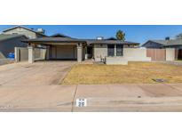 Charming single-story home with a covered carport and low maintenance desert landscaping at 28 W Hillside St, Mesa, AZ 85201