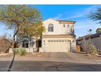 Charming two-story home features a tile roof and a two-car garage at 6795 S Sapphire Way, Chandler, AZ 85249