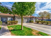 Charming townhome with well-maintained landscaping and inviting curb appeal, perfect for a comfortable lifestyle at 7401 W Arrowhead Clubhouse Dr # 2079, Glendale, AZ 85308