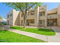 Inviting condo featuring a well-maintained lawn and desert landscaping, offering a blend of comfort and style at 11333 N 92Nd St # 2072, Scottsdale, AZ 85260