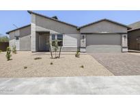 Single Gathering home features desert landscaping, gray exterior, and two car garage at 4210 E Desert Vista Trl, Cave Creek, AZ 85331