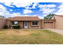Charming single-story home featuring a well-maintained front yard and an attached single car garage at 54 Leisure World --, Mesa, AZ 85206