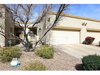 Charming single-story home featuring a two-car garage and desert landscaping in a well-maintained community at 6730 E Hermosa Vista Dr # 20, Mesa, AZ 85215