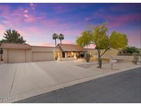 Beautiful single-story home featuring desert landscaping, mature tree, and a three-car garage at 7820 S Maple Ave, Tempe, AZ 85284