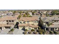 Beautiful two-story home featuring a well-maintained lawn and desert landscaping at 2428 E Iris Dr, Chandler, AZ 85286