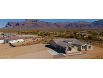 A charming new home in Arizona offers fantastic mountain views and a three car garage at 2775 S Baker Dr, Apache Junction, AZ 85119