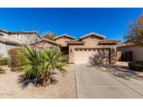 Charming home with a two-car garage and desert landscaping at 2798 W William Ln, San Tan Valley, AZ 85144