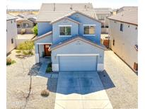 Charming two-story home with a two-car garage and low maintenance landscaping at 35771 W Costa Blanca Dr, Maricopa, AZ 85138