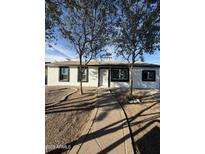 Charming home featuring a well-kept front yard and a welcoming walkway at 5846 W Cheery Lynn Rd, Phoenix, AZ 85031