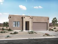 Contemporary home exterior featuring a two-car garage and desert landscaping at 34598 N Elmwood Way, San Tan Valley, AZ 85144