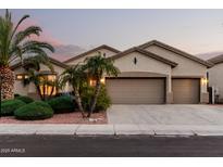 Charming single-story home featuring a spacious three-car garage, desert landscaping, and neutral color palette at 3887 E Andre Ave, Gilbert, AZ 85298