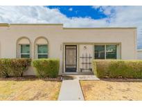 Charming home featuring desert landscaping, decorative metalwork, and a welcoming walkway at 5809 E Thomas Rd, Scottsdale, AZ 85251