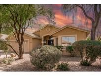 Charming single-story home with desert landscaping, warm stucco exterior, and well-maintained front yard at 7635 E Pampa Ave, Mesa, AZ 85212