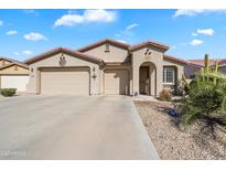 Charming single-story home featuring a three-car garage, desert landscaping, and a welcoming facade at 860 E Cierra Cir, San Tan Valley, AZ 85143