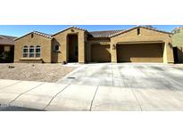 Charming single-story home featuring a two-car garage and low-maintenance desert landscaping at 236 N Wesley --, Mesa, AZ 85207