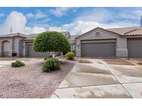 Charming single-story home showcasing a low maintenance desert landscape and an attached two-car garage at 4202 E Broadway Rd # 93, Mesa, AZ 85206
