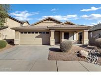 Charming single-story home with a well-maintained front yard, covered entryway, and attached two-car garage at 12316 W Rancho Dr, Litchfield Park, AZ 85340