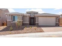Charming single-Gathering home featuring stone accents, neutral color palette, and a two-car garage at 13803 W Calle De Baca --, Peoria, AZ 85383
