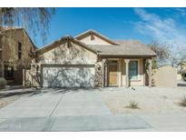 Charming single-story home featuring a two-car garage, neutral paint, and low maintenance desert landscaping at 18342 W La Mirada Dr, Goodyear, AZ 85338