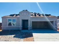 View of a one-story home with a stucco exterior and an attached garage in a new construction community at 28200 N Nealite Dr, San Tan Valley, AZ 85143