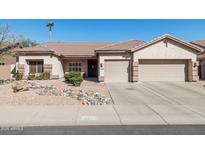 Charming single-story home featuring a two-car garage and low-maintenance desert landscaping at 4936 E Villa Rita Dr, Scottsdale, AZ 85254