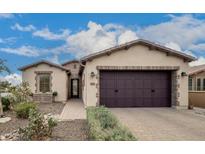 Charming single-story home featuring a two-car garage and desert landscaping at 1805 E Atole Pl, Queen Creek, AZ 85140