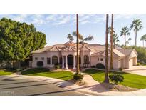 Stunning home showcasing a perfectly manicured front yard with an impressive circular driveway at 3441 S Camellia Pl, Chandler, AZ 85248