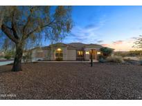 Charming single-story home with desert landscaping and a welcoming entrance at 2855 N Silver Spur Dr, Wickenburg, AZ 85390