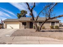 Charming single-story home featuring a low maintenance yard and attached two-car garage at 200 E Hess Ave, Coolidge, AZ 85128