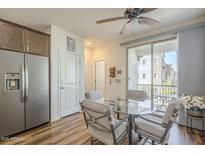 Bright dining area with sliding glass doors and a view of the outdoor scenery at 2673 S Balsam Dr, Gilbert, AZ 85295