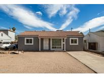 Charming single story home with neutral tones, tile roof and desert landscaping at 4205 N 3Rd Ave, Phoenix, AZ 85013