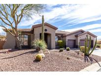 Charming desert home with beautiful landscaping, native plants and a three car garage at 42429 N Cross Timbers Ct, Anthem, AZ 85086