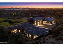 Luxury estate with modern design, featuring a large motor court and stunning desert and city views at 9820 E Thompson Peak Pkwy # 629, Scottsdale, AZ 85255