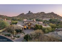 Breathtaking hillside home with a beautiful stone facade and desert landscaping at 27914 N 100Th Pl, Scottsdale, AZ 85262
