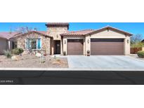 Charming single-story home featuring a two-car garage and desert landscaping at 4576 W Agave W Ave, Eloy, AZ 85131