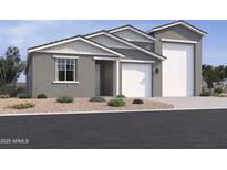 Charming single-story home with a three-car garage and a well-maintained desert landscape at 5523 W Hopi Trl, Laveen, AZ 85339