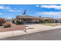 Charming single-story home featuring a well-maintained front yard and a spacious driveway, perfect for a serene neighborhood setting at 10801 W Mountain View Rd, Sun City, AZ 85351