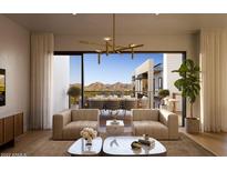 Bright living room featuring stylish seating, modern lighting, and an open balcony with mountain views at 19355 N 73Rd Way # 4016, Scottsdale, AZ 85255