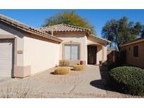 Charming single-story home featuring a well-maintained front yard, tiled roof, and inviting entrance at 30067 N Clover Way, San Tan Valley, AZ 85143
