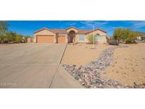 Charming single-story home with a three-car garage and desert landscaping at 730 E Tanya Trl, Phoenix, AZ 85086
