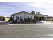 Inviting single-story home featuring desert landscaping and a covered carport at 891 W Moon Shadow Dr, Casa Grande, AZ 85122