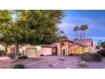 Charming single-story home with a well-manicured lawn, tile roof, and attached two-car garage at 9445 S La Rosa Dr, Tempe, AZ 85284