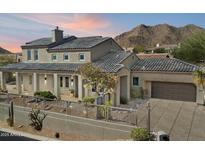 Gorgeous southwestern-style home with well-maintained landscaping and mountain views at 13662 E Shaw Butte Dr, Scottsdale, AZ 85259