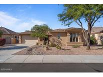 Charming single-story home with desert landscaping, neutral stucco, and a spacious two-car garage at 15442 W Sells Dr, Goodyear, AZ 85395