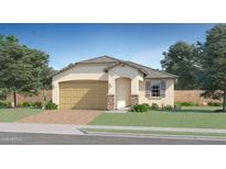 Inviting single-story home featuring a two-car garage and stone accents, complemented by a well-manicured lawn at 15564 W Williams St, Goodyear, AZ 85338