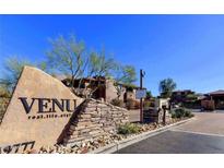 Inviting entrance to the VENU community featuring lush landscaping and a monument sign at 19777 N 76Th St # 2150, Scottsdale, AZ 85255