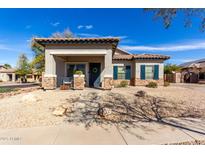 Charming home with a tile roof, stone accents, a welcoming porch, and well-maintained landscaping at 3426 E Elgin St, Gilbert, AZ 85295