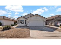 Charming single-story home features a well-maintained front yard and an attached two-car garage at 3823 W Tonopah Dr, Glendale, AZ 85308