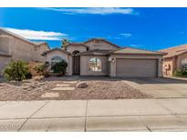 Charming single-story home with desert landscaping and neutral-toned exterior at 4325 E Cedarwood Ln, Phoenix, AZ 85048